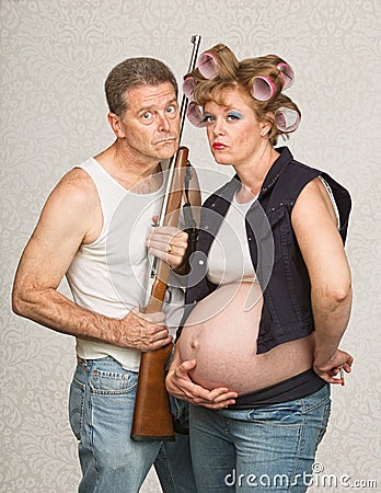 Serious Pregnant Hillbilly Couple Stock Photo