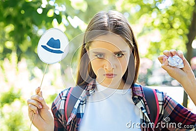 Serious promising entrepreneur setting goals with thinking hats Stock Photo