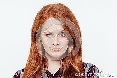 Serious redhead woman looking at camera Stock Photo