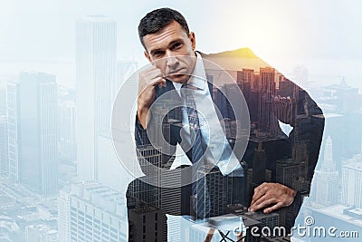 Serious reliable businessman looking thoughtful and tired Stock Photo