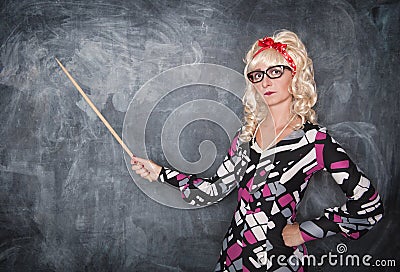 Serious retro teacher in glasses with pointer Stock Photo