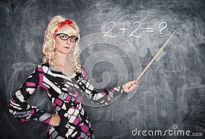 Serious retro teacher in glasses with pointer Stock Photo