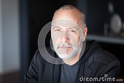 Serious Senior Man looking At The Camera. With a gray beard. Depression Stock Photo