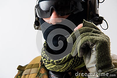 Serious soldier telling by earphones Stock Photo