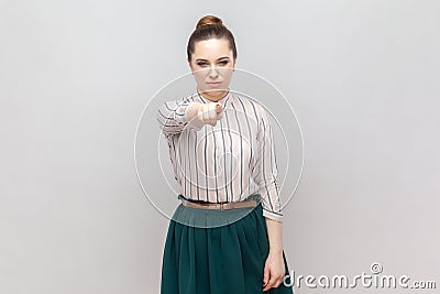 Serious strict bossy woman standing pointing to camera, choosing you, scolding. Stock Photo