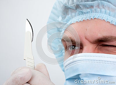 Serious surgeon with knife Stock Photo