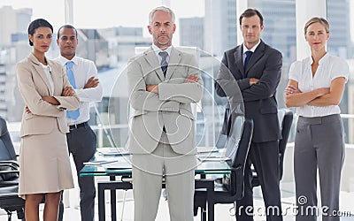 Serious team of business people posing together Stock Photo