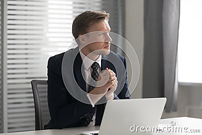 Serious thoughtful businessman feel doubtful concerned about business challenge Stock Photo