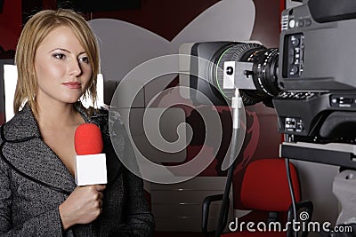 Serious TV reporter in live transmission Editorial Stock Photo