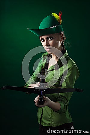 Serious woman with crossbow Stock Photo