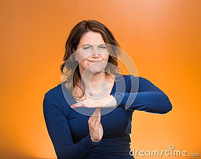 Serious woman showing time out gesture with hands Stock Photo