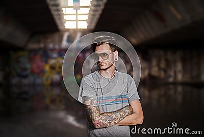 Serious young adult tattooed man subculture Stock Photo