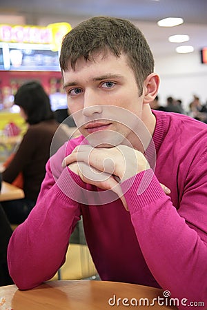 Serious young man in cafe Stock Photo