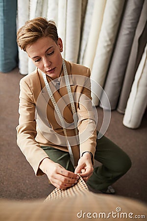 Tailor pinning the dress Stock Photo