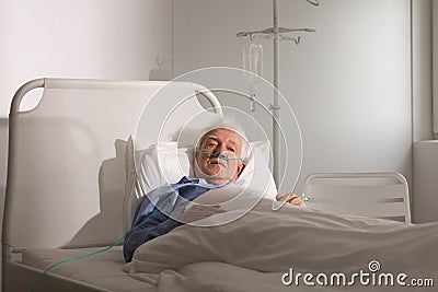 Seriously ill senior man Stock Photo