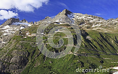 Serpentine road connecting alpine passes Furka and Grimsel in Swiss Alps Stock Photo