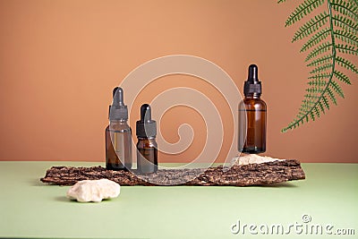 Serum glass bottle set on brown and green background Stock Photo
