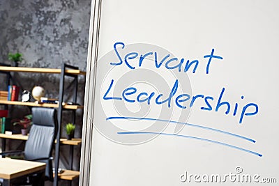 Servant leadership written on the whiteboard in the office. Stock Photo