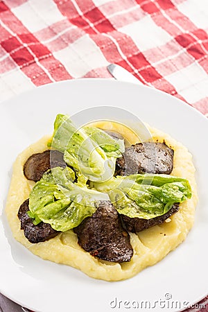 Served fried Chicken Liver with Mashed Potatoes and Lettuce Stock Photo