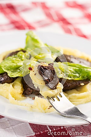 Served fried Chicken Liver with Mashed Potatoes and Lettuce Stock Photo