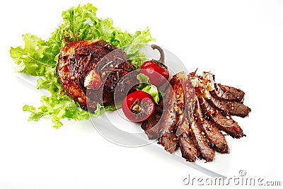 Served meat on ceramic plate Stock Photo