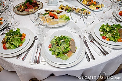 Served round banquet table with dishes Stock Photo