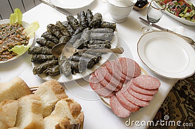 Served table with stuffed grape leaves and a snack Stock Photo