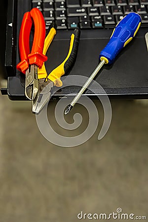 Server assembly set pliers wire cutters screwdriver computer technology engineering background close-up Stock Photo