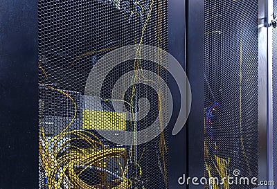 Server rack cluster in data center. Network server room with servers high performance computers running processes Stock Photo