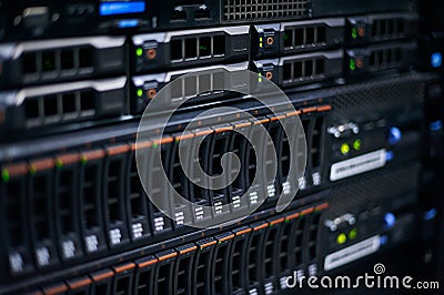 Server room full of racks and servers Stock Photo