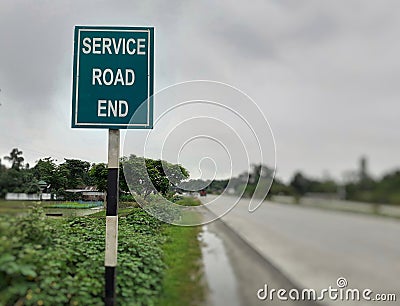 Service road end signboard at highway Stock Photo