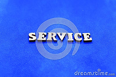 Service white wooden letters on blue background Stock Photo