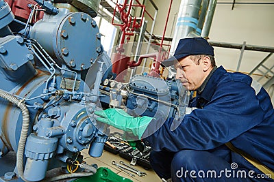 Service worker at industrial compressor station Stock Photo