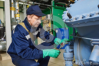 Service worker at industrial compressor station Stock Photo