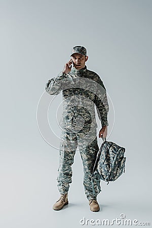 serviceman in cap and army uniform Stock Photo