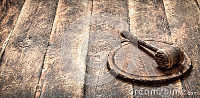 Serving background. Old meat mallet on a cutting Board. Stock Photo