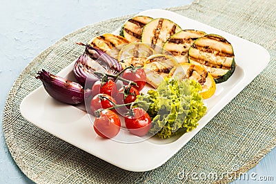 Serving of delicious roasted and fresh vegetables Stock Photo