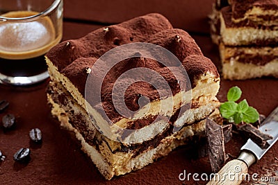 Serving of freshly made tiramisu with mint garnish Stock Photo