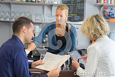 Serving happy adults in bar Stock Photo