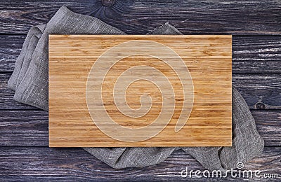 Serving tray over old wooden table, cutting board on dark wood background, top view Stock Photo