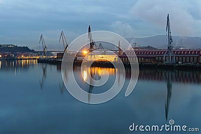 Sestao cranes from Erandio at night Stock Photo