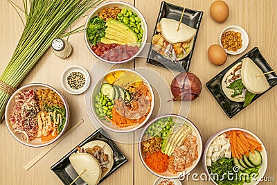 Set of Asian healthy food dishes, with salmon poke bowl, marinated Stock Photo