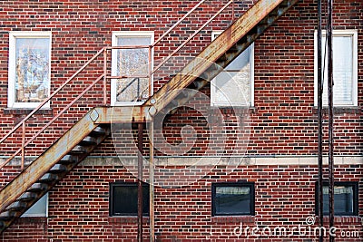 back alley rusted stairs window brick building Stock Photo