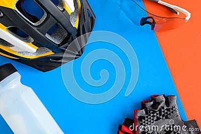 set bicycle equipment on a blue and orange paper background Stock Photo