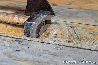 Set of black metal tools logging sledgehammer ax on a wooden background design master tool manual Stock Photo