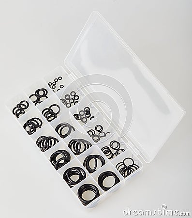 A set of black rubber gaskets in plastic transcend box Stock Photo