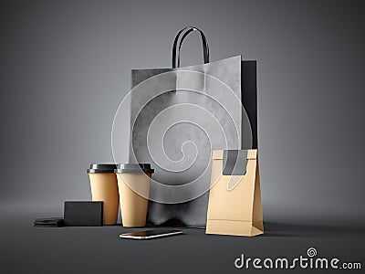 Set of black shopping bag, coffee cups, paper package, blank business cards and generic design smartphone. Dark Stock Photo