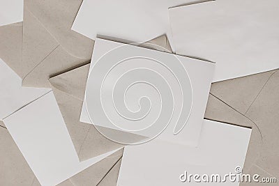 Set of blank letters with craft envelopes on table. Closeup of empty greeting cards, invitations. Stationery mockups Stock Photo