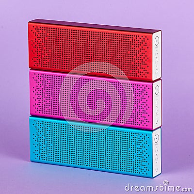 Set of bluetooth speakers different colors on colorful background Stock Photo