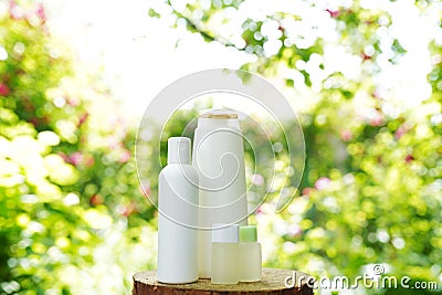 Set of body skin care products on nature background, copy space. Shampoo, gel, oil Stock Photo